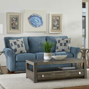 feature lofty cushions that are removable for easy cleaning and are lined with welt detailing for a crisp, clean silhouette. T-shaped back cushions will stay firmly in place and will not slip or slide while seated. Additional welt detailing on the rolled arms and front rail lends a subtly tailored appearance, and each piece rests on low, finished, tapered wood legs.