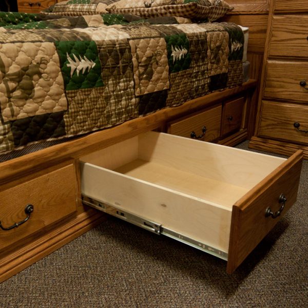 solid wood bedroom set showing underbed storage drawer fully extends